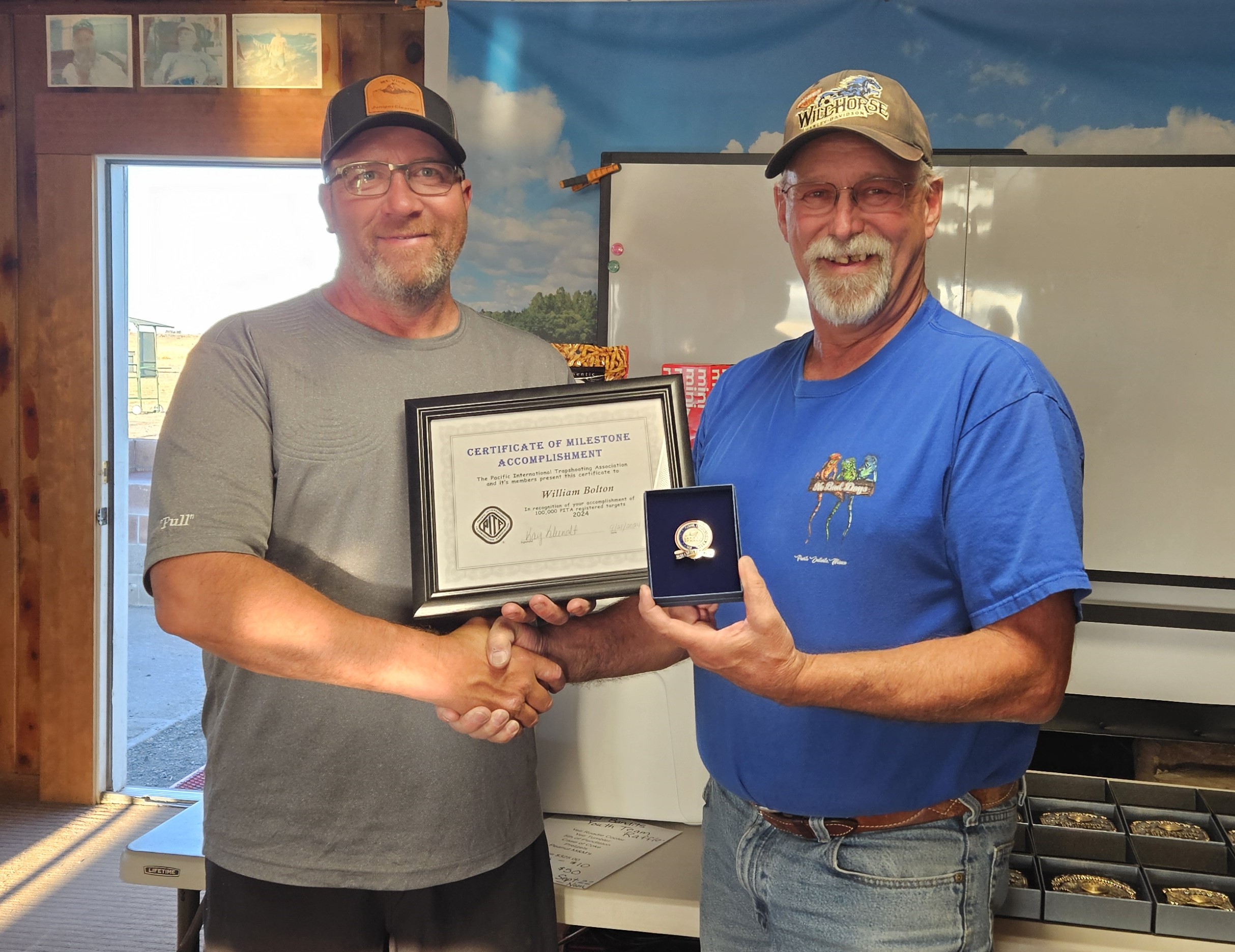 Dean presents Bill Bolton his 100000 pin